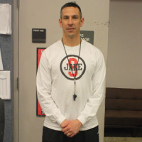 Coach Bushman wears t-shirt in memory and support of Jake Arnston.