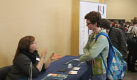 Lilly Scarth, MAA sophomore, talks to Marylhurst University Admissions Counselor Josephine Sorensen.