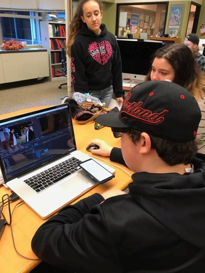 Producers review footage shot for their senior seminar project.